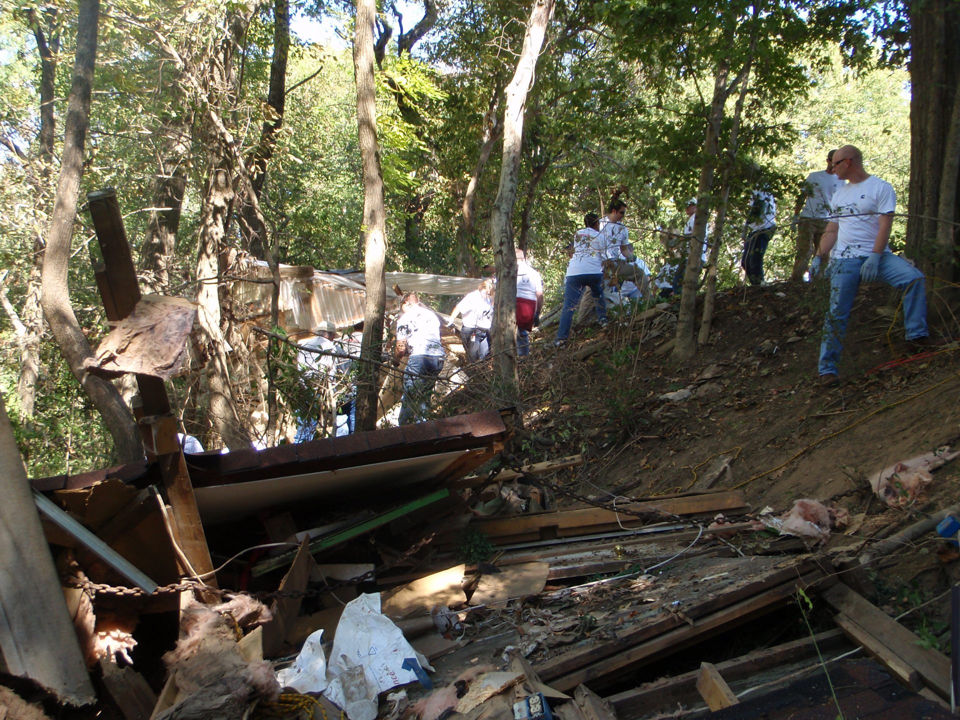 debris in beech bend with people in river bank